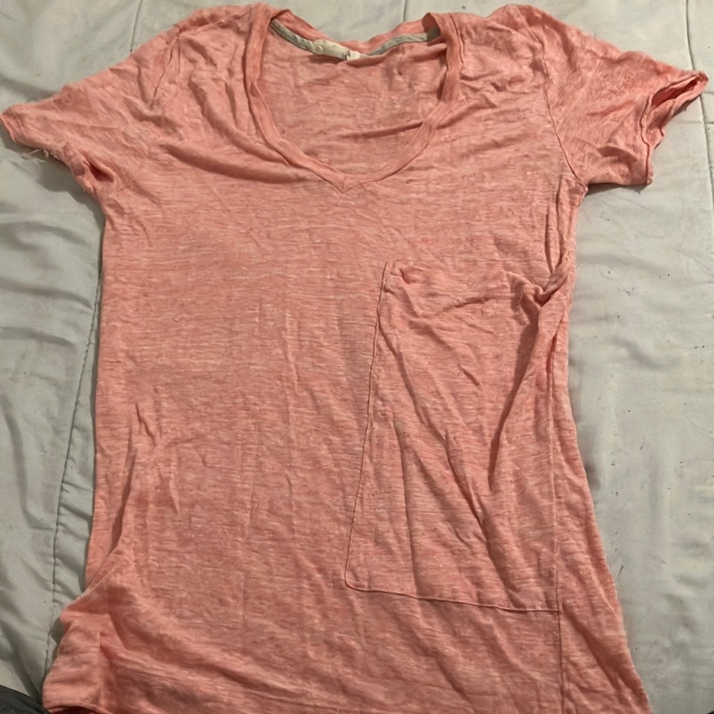 Pink short sleeve women’s shirt. Size small with a pocket in the front